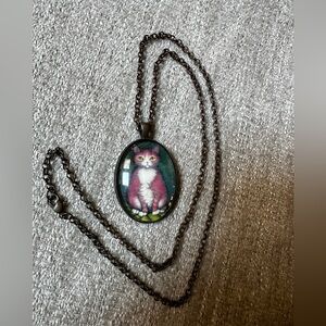 Necklace featuring the artwork of artist, Heidi Shaulis.